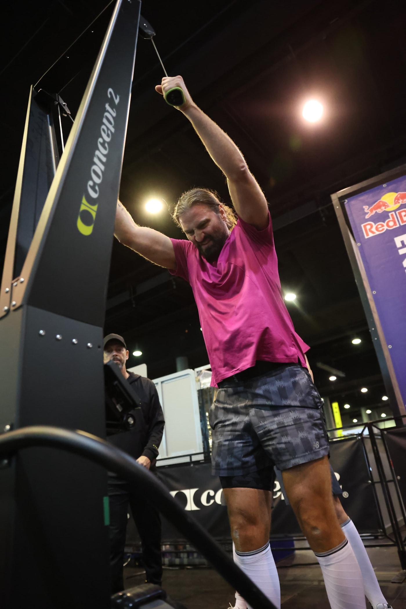 Man on SkiErg in Hyrox competition