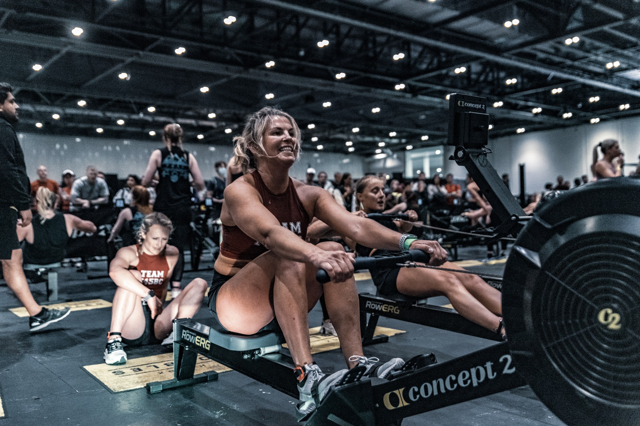 Woman on RowErg in Hyrox competition
