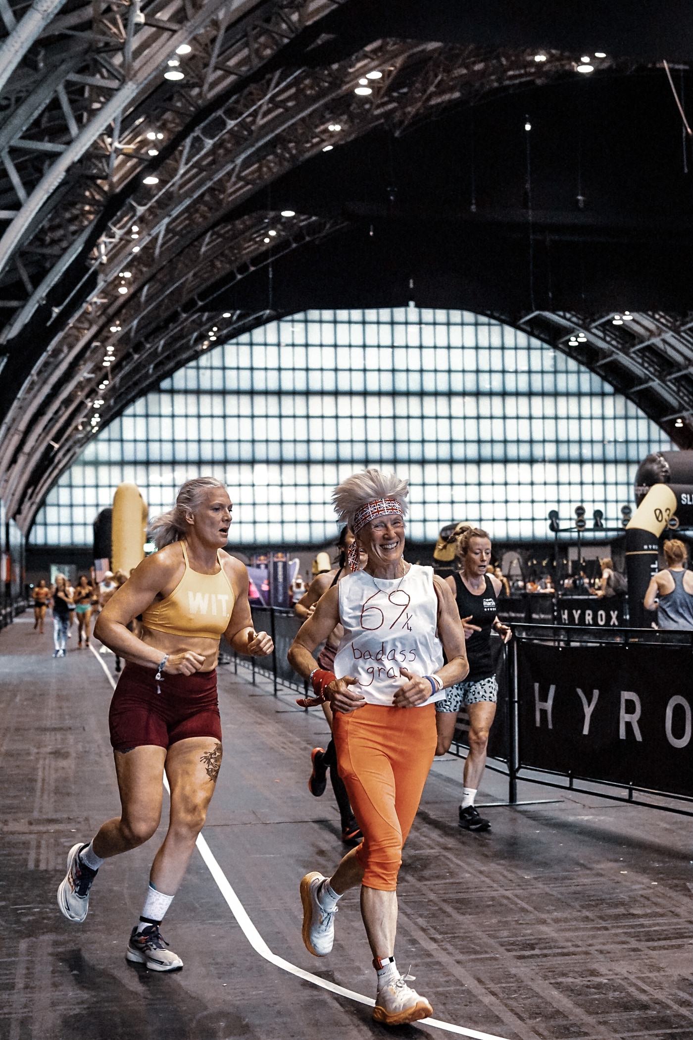 Women running in a Hyrox competition