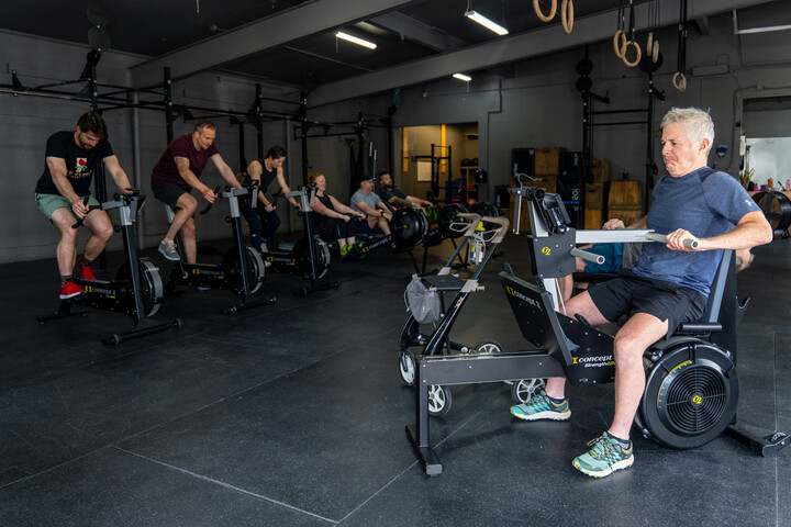 male using strengtherg with concept2 bikeergs in background